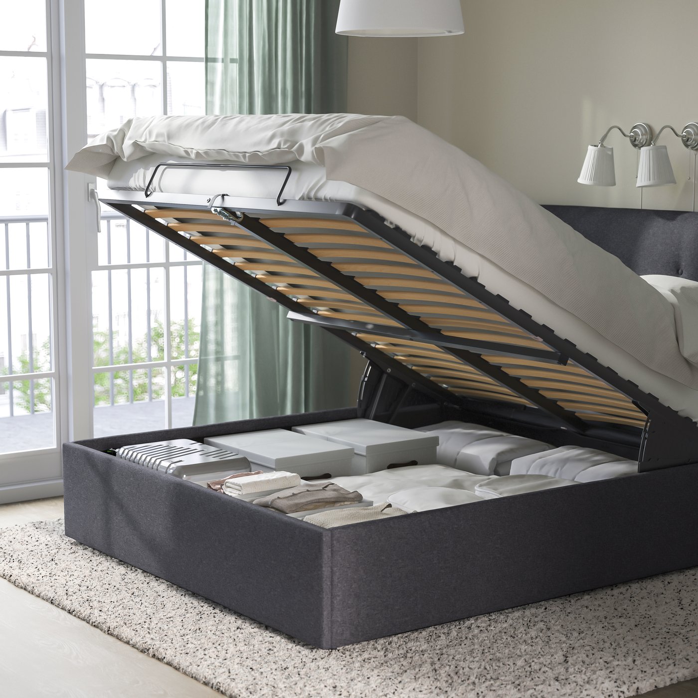A Gunnared dark grey IDANÄS upholstered ottoman bed