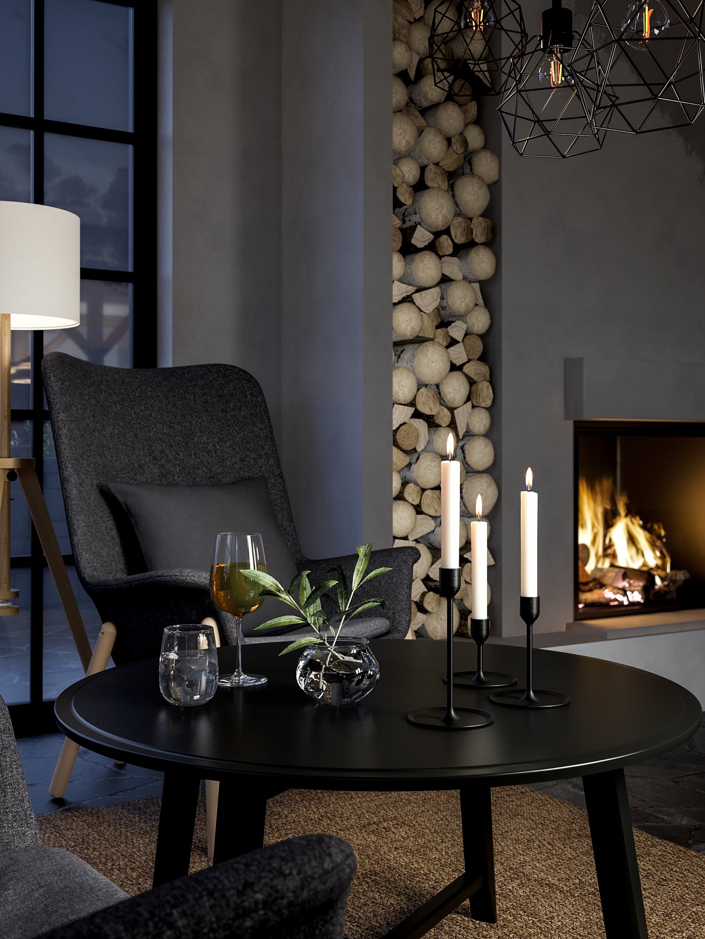 Salón con un juego de 3 candelabros negros de aluminio sobre una mesa de centro redonda junto a un sillón con respaldo alto.