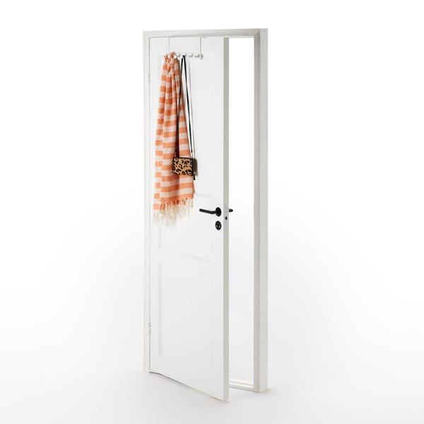 A freestanding white door is slightly open. It has an ENUDDEN hanger holding accessories installed on its top edge.