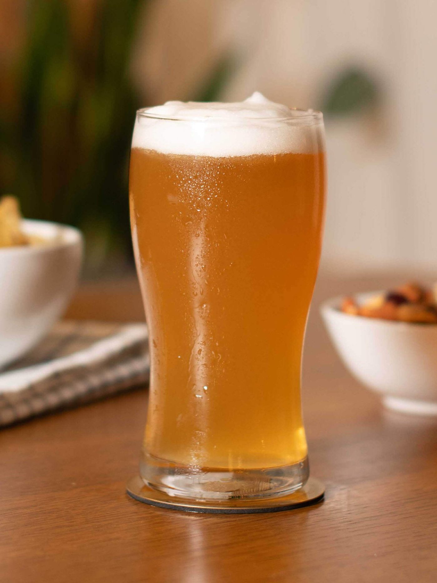 A clear glass LODRÄT beer glass