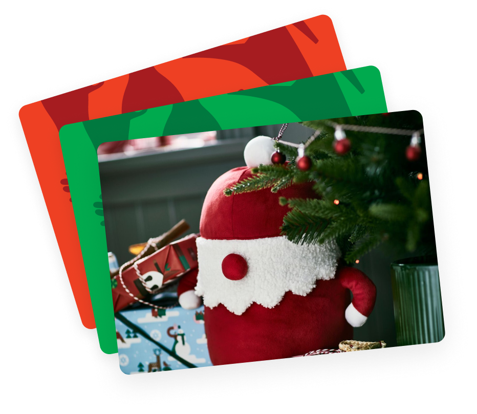 An image of three loosely stacked IKEA gift cards in the colors yellow, green and pink.