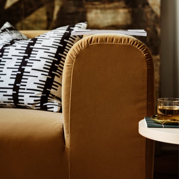 A brass-colour STOCKHOLM 2025 bowl and dish in the living room