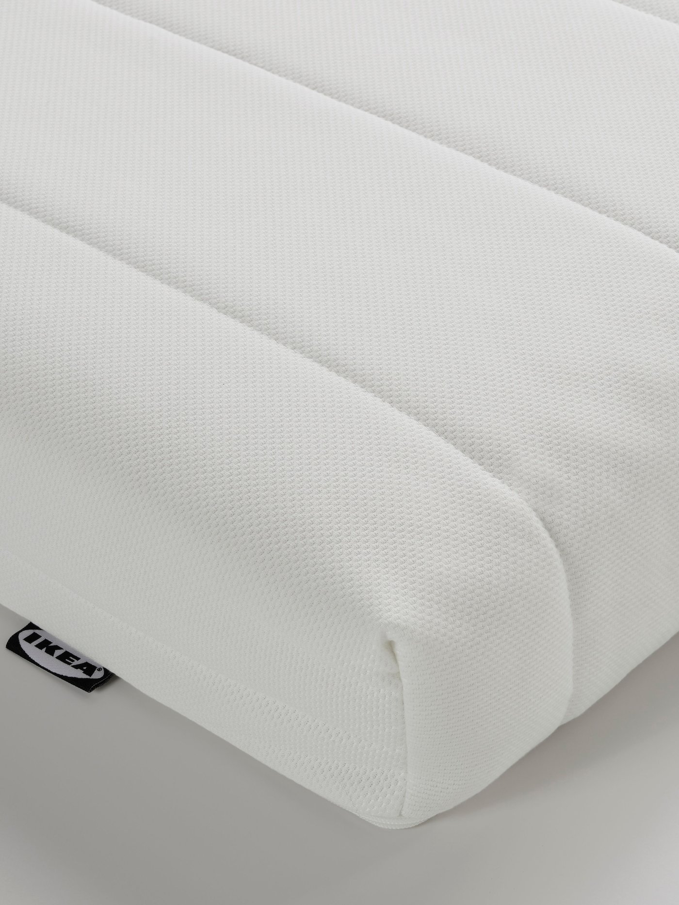 A medium firm/white ÅFJÄLL foam mattress