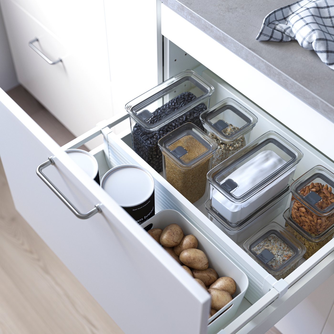 A transparent KORALLVIPPA dry food jar with lid in the kitchen
