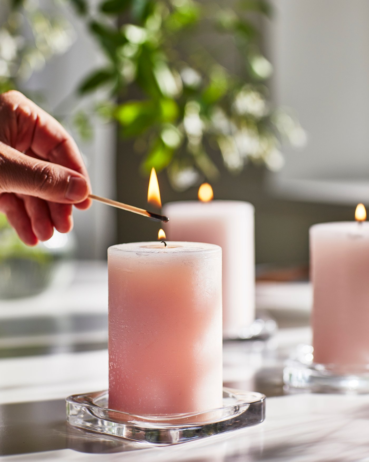 A Jasmine/pink LUGNARE scented pillar candle