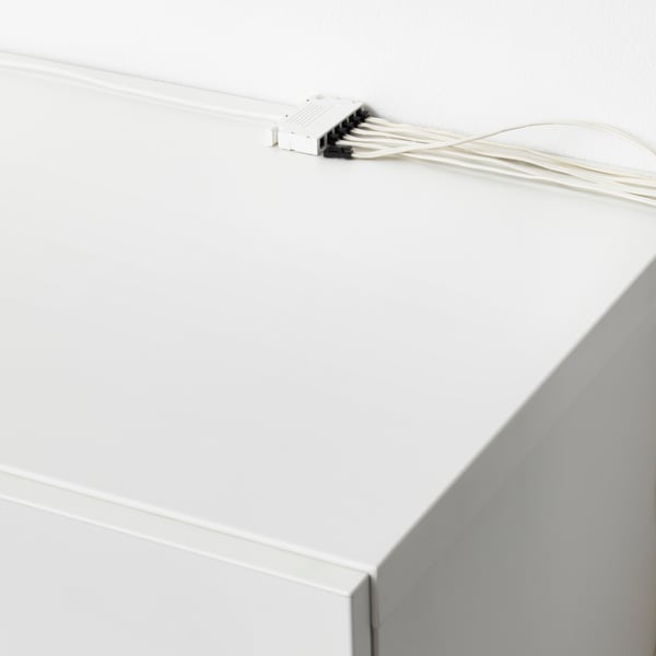 Lighting above a white cabinet with an ANSLUTA driver