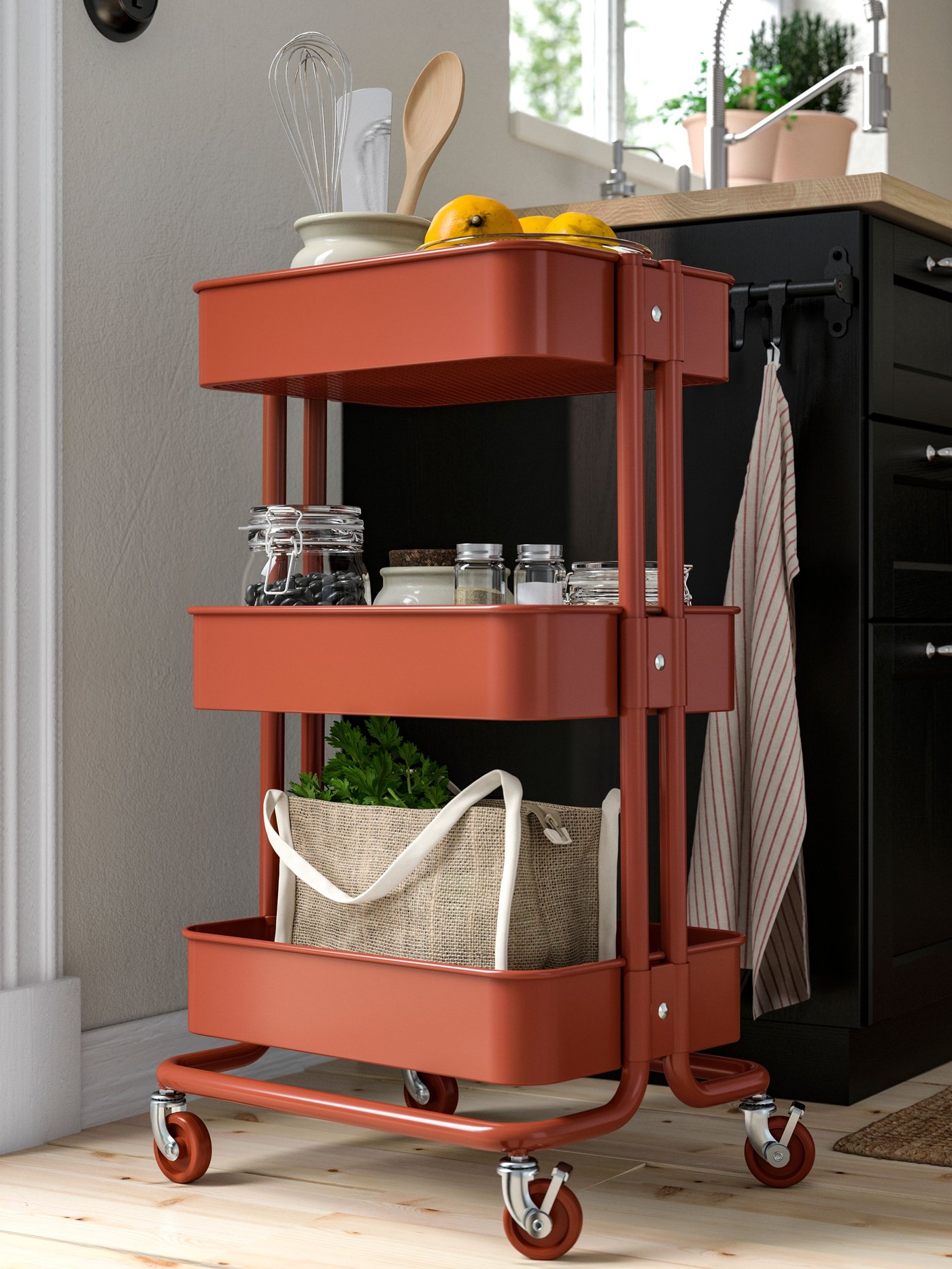 A red-brown RÅSKOG trolley