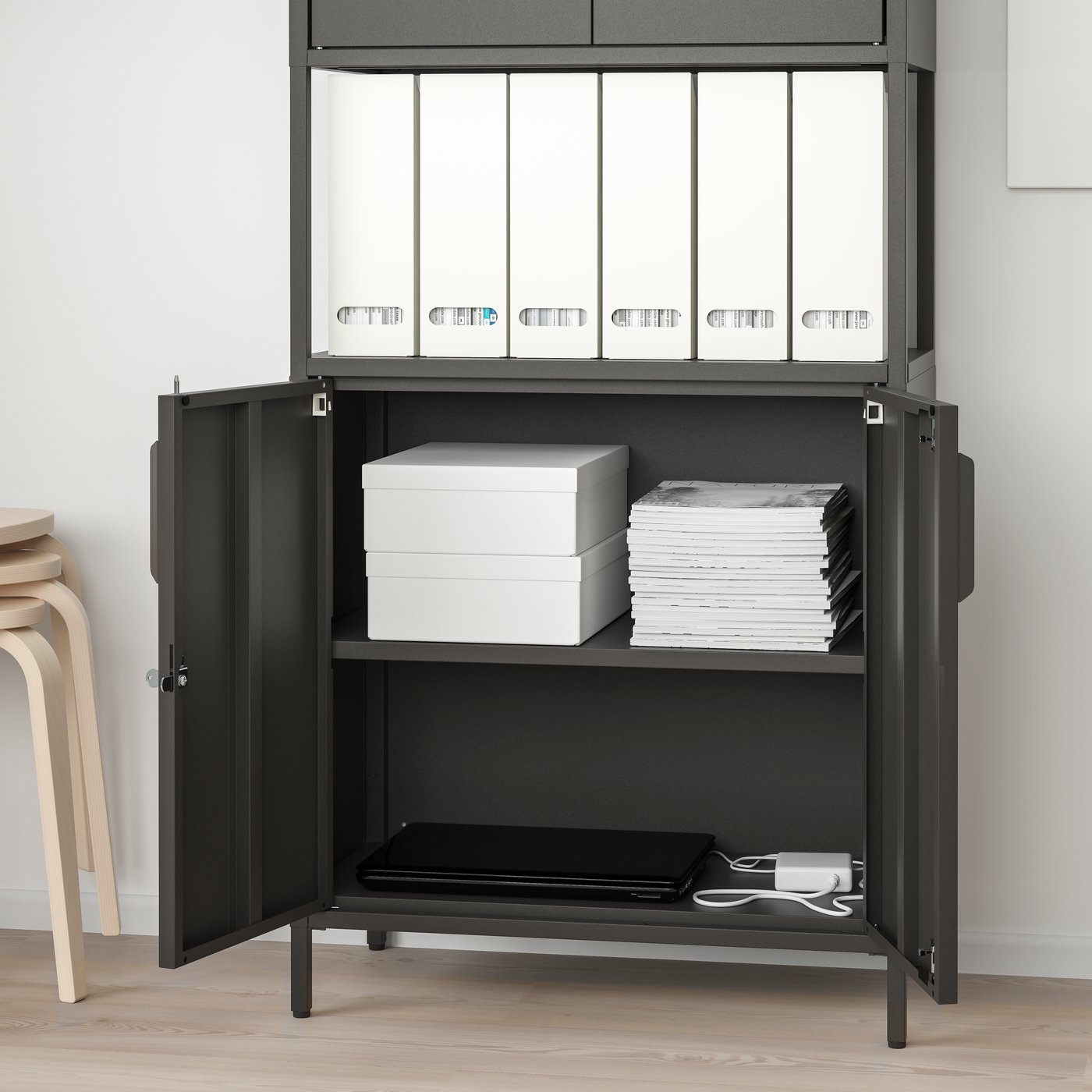 An anthracite TROTTEN cabinet with doors in the home office