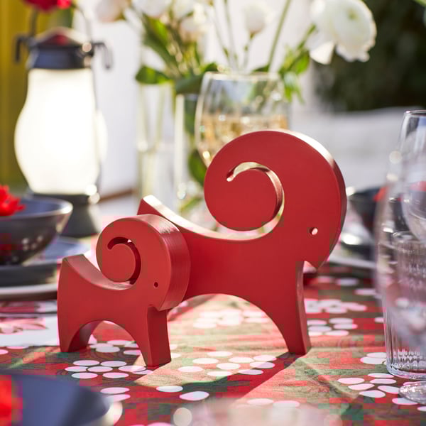 A goat red VINTERFINT decoration outside