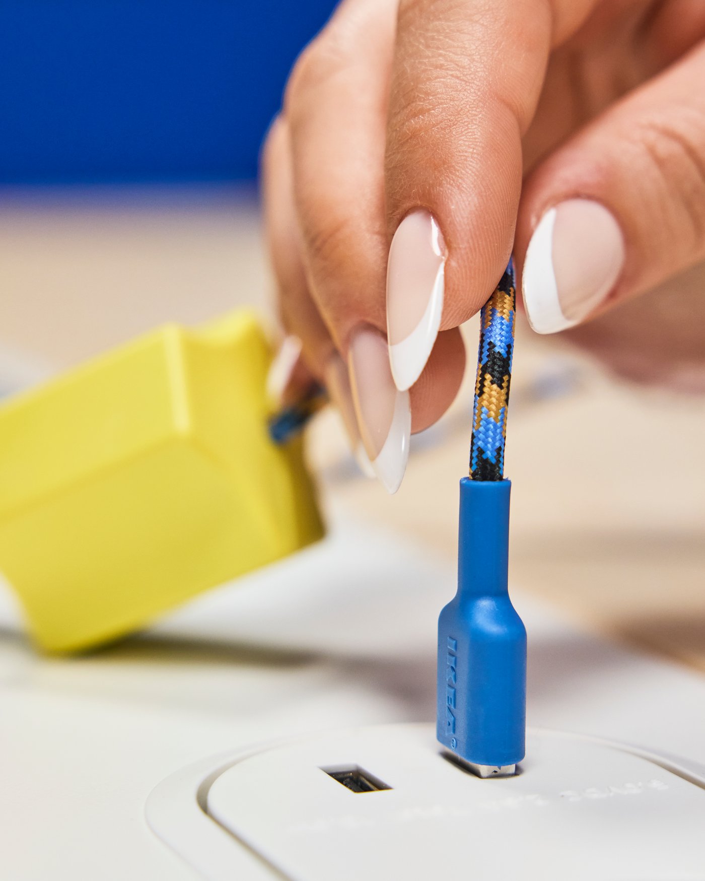 A blue/orange LILLHULT USB-A to USB-C in the home office