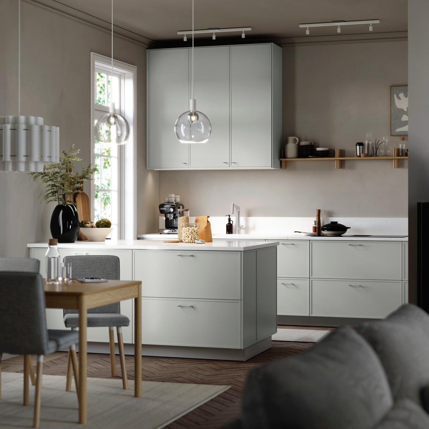 ASPUDDEN light gray kitchen fronts in a bright kitchen with white worktop, plants, dining space and pendant lamps.