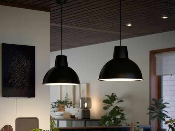 A black SKURUP pendant lamp in the kitchen