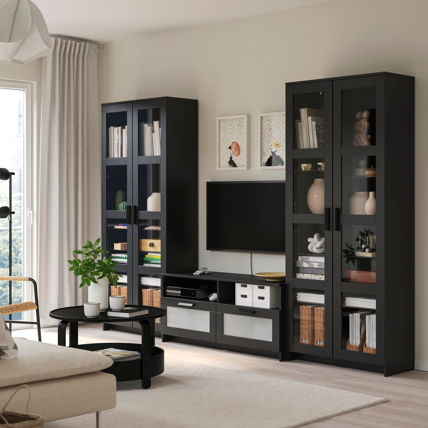 A black BRIMNES TV storage combination/glass doors