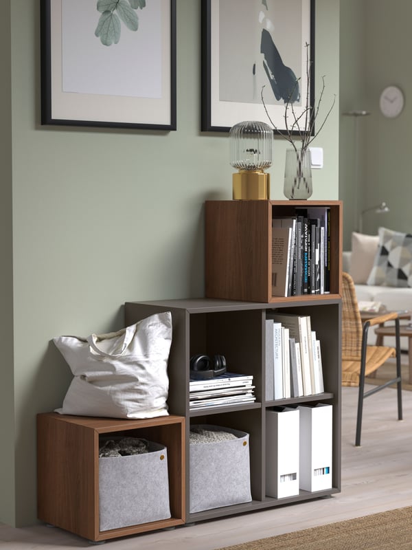 A dark grey/walnut EKET cabinet combination with feet