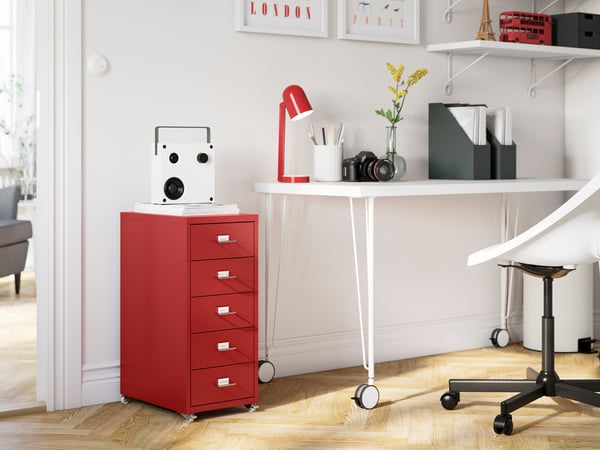 A red HELMER drawer unit on castors in the home office
