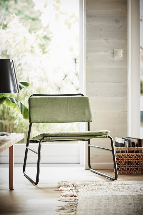 An Orrsta olive-green LINNEBÄCK easy chair