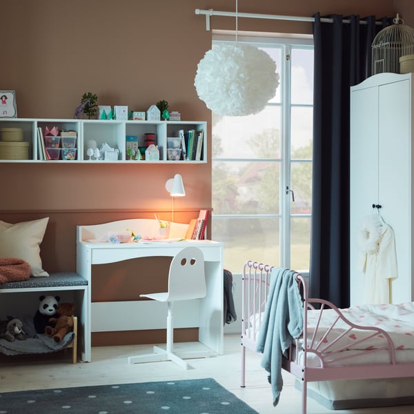A white SIBBEN children's desk chair in the childrens room
