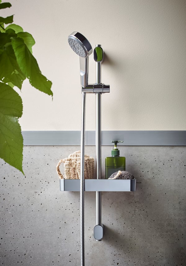A chrome-plated BROGRUND riser rail with handshower kit in the bathroom