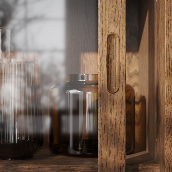 A brown stained oak veneer TONSTAD cabinet with sliding glass doors