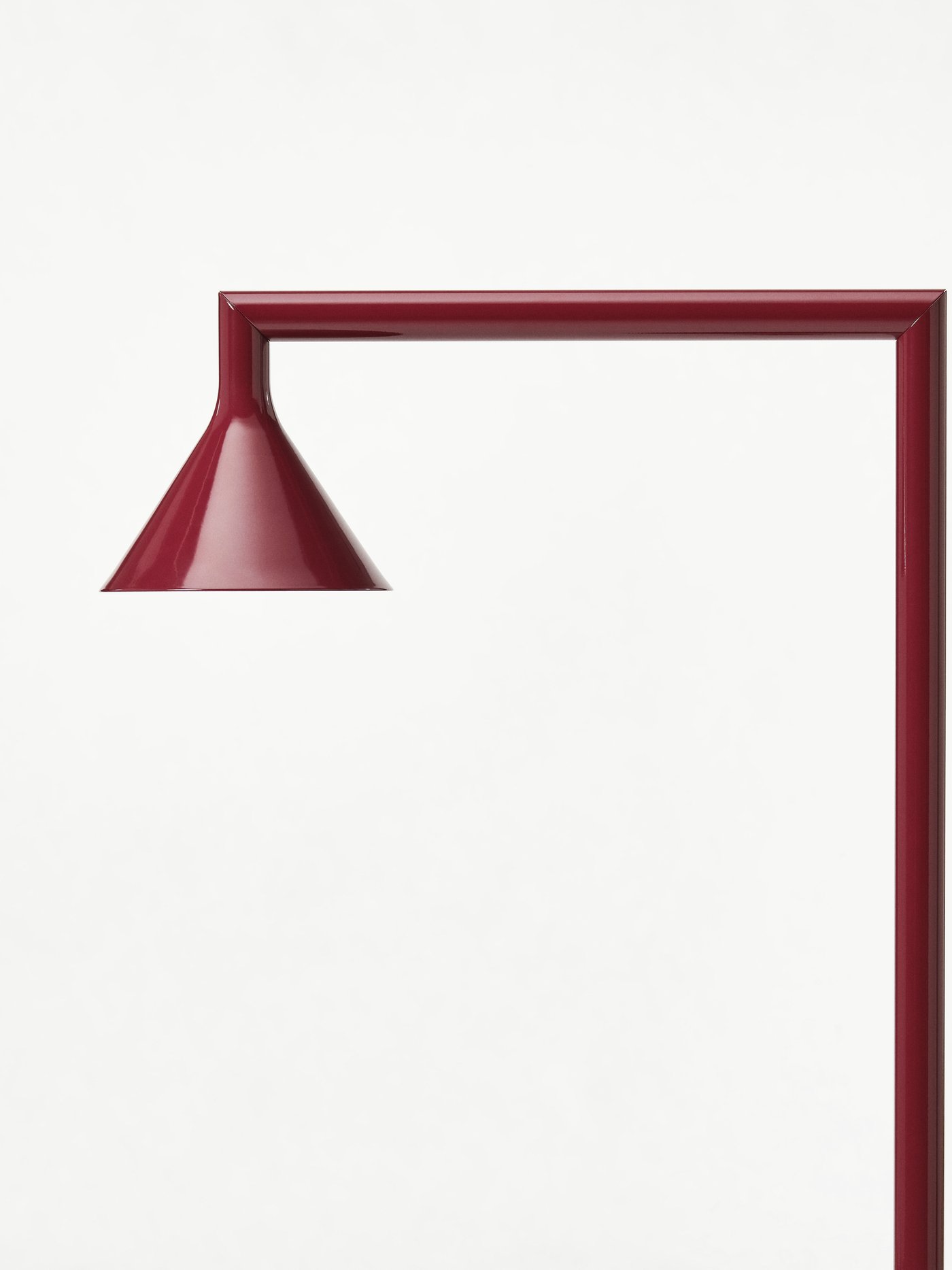 A dark red IKEA PS 2026 floor uplighter
