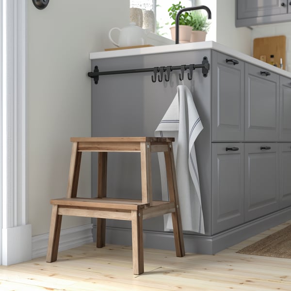 An acacia BEKVÄM step stool