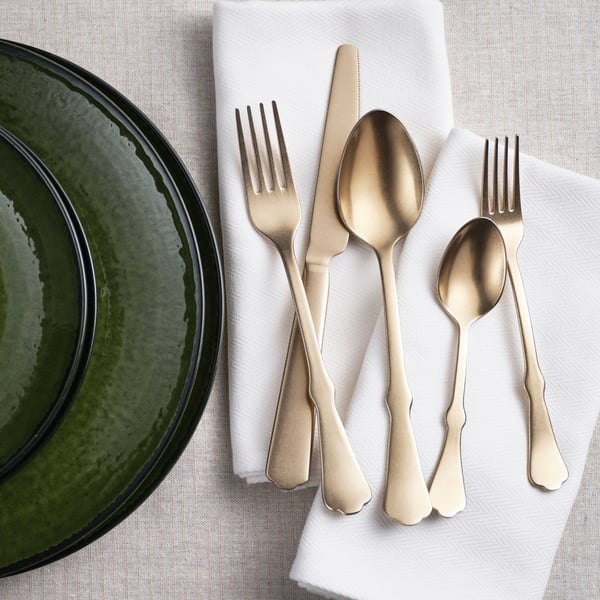 A gold-colour NATTKLOT 24-piece cutlery set in the NA