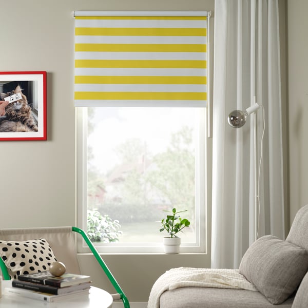 A white yellow/striped FRIDANS block-out roller blind