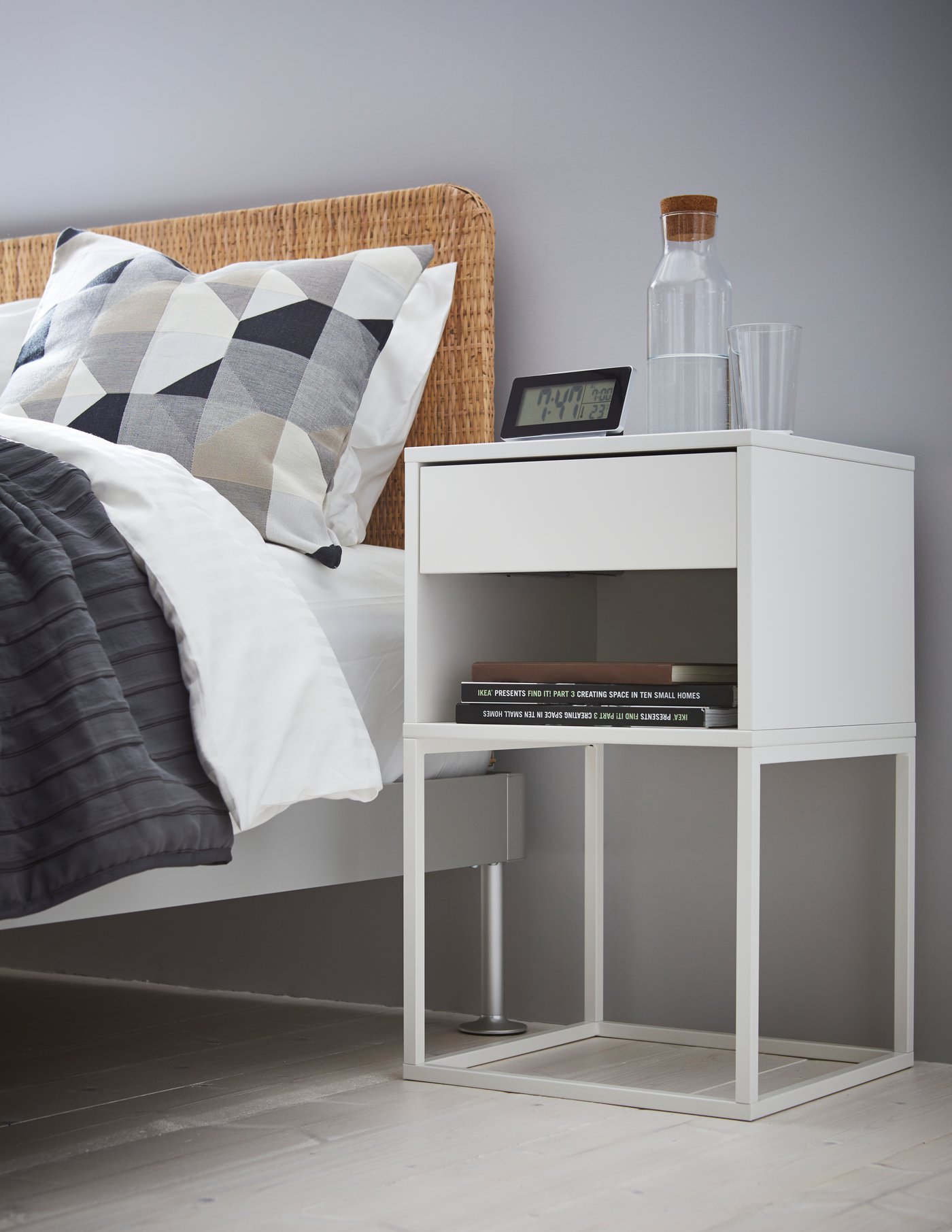 A black FILMIS clock/thermometer/alarm in the bedroom