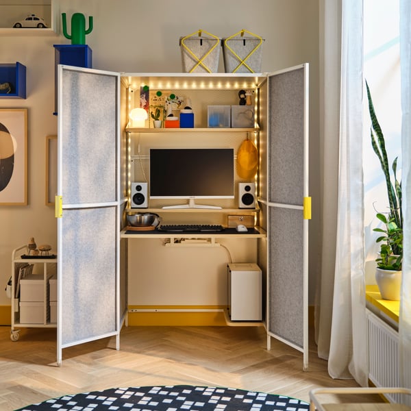 A light grey/white BRÄNNBOLL gaming station
