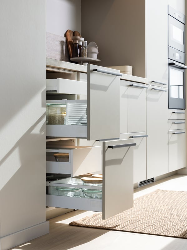 Kitchen with HAVSTORP kitchen fronts, with window and kitchen appliances in the background.