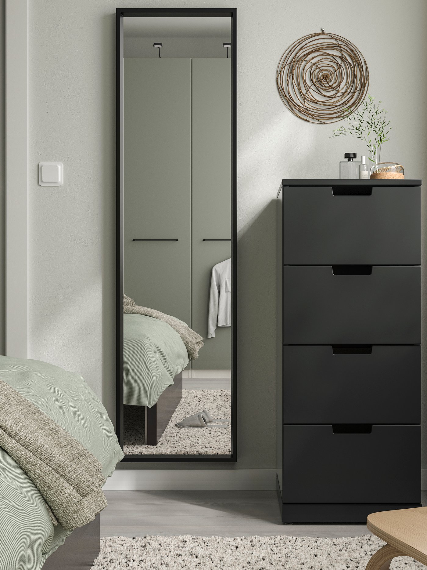 A black NISSEDAL mirror in the bedroom