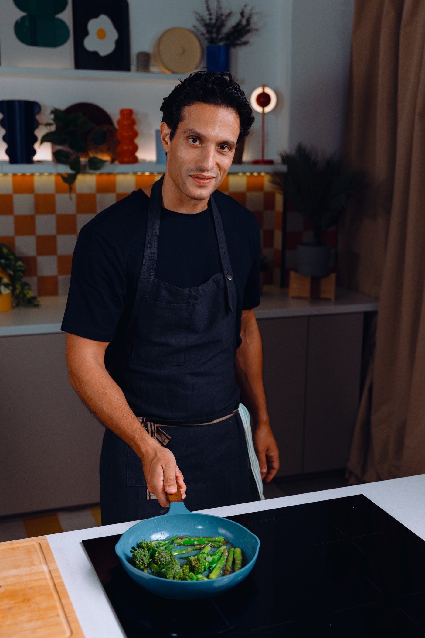 Chef Carlos Afonso cooking salmon with bulgur