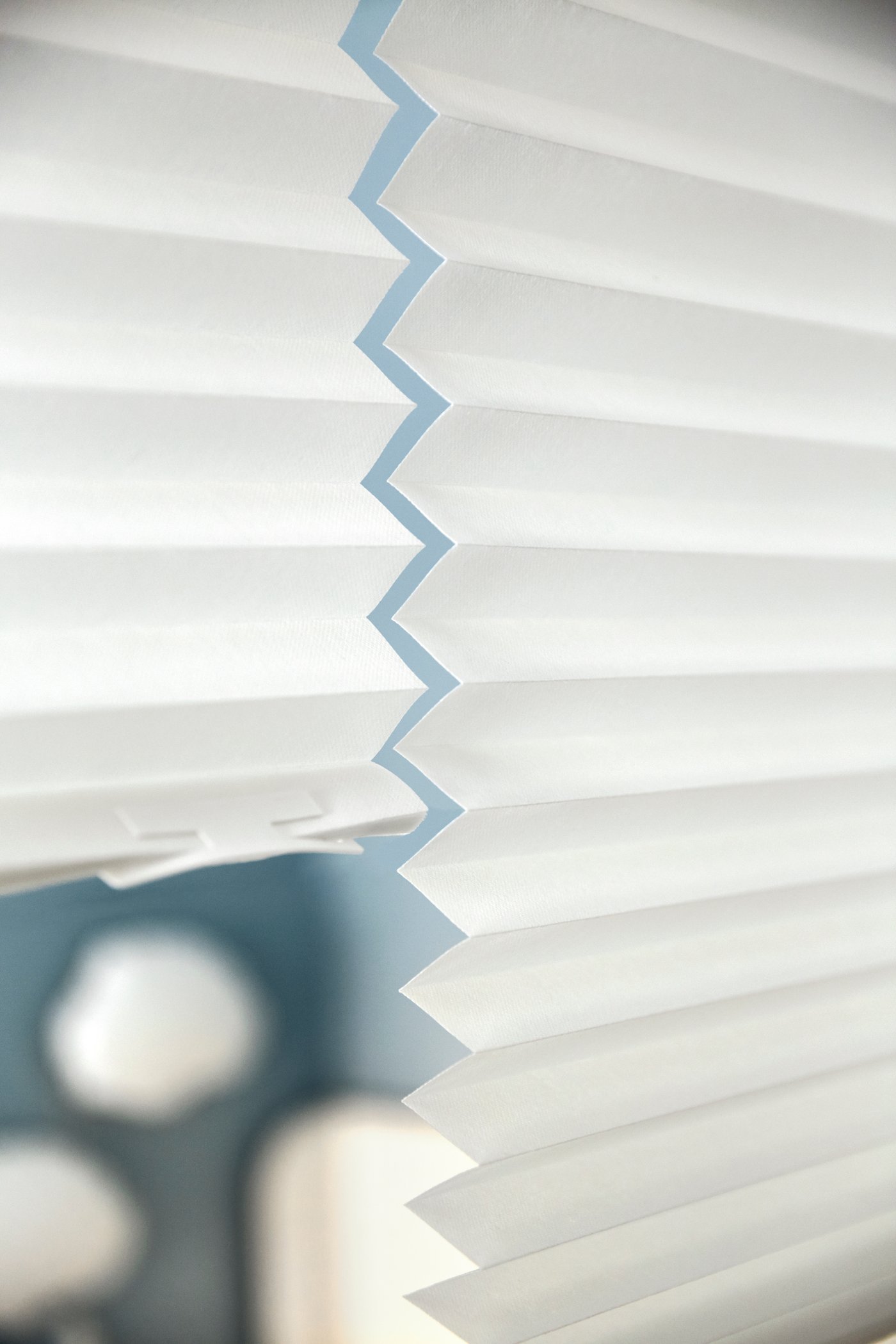 A white SCHOTTIS pleated blind