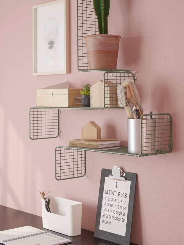 Study room with SVENSHULT wall shelf in grey-green displayed on the wall.