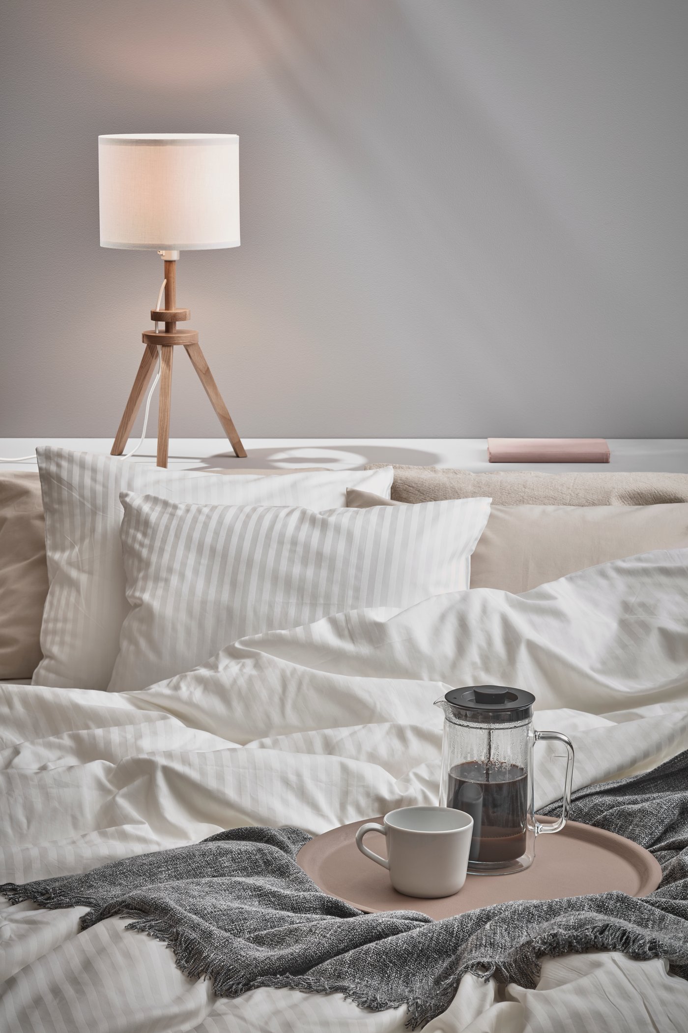 A white NATTJASMIN duvet cover and 2 pillowcases in the bedroom