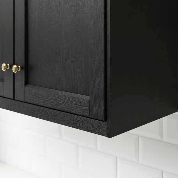 A black LERHYTTAN wall cabinet with decorative moulding.