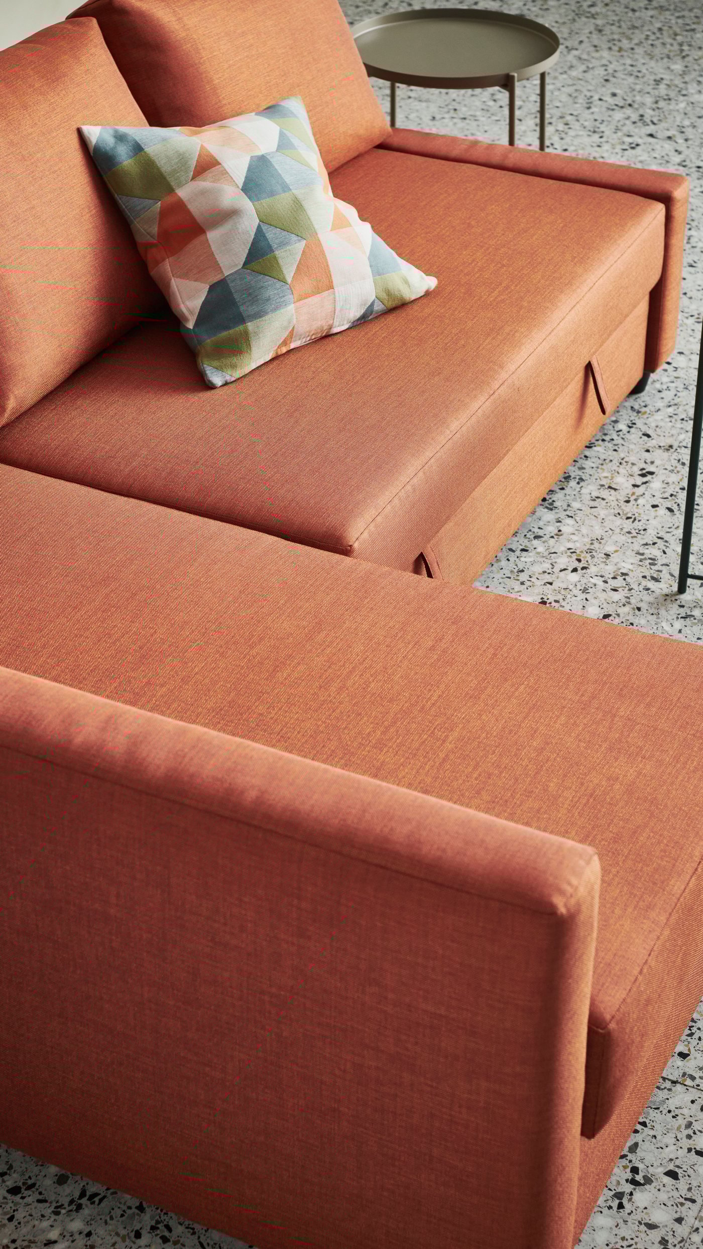 An orange/multicolour SVARTHÖ cushion cover