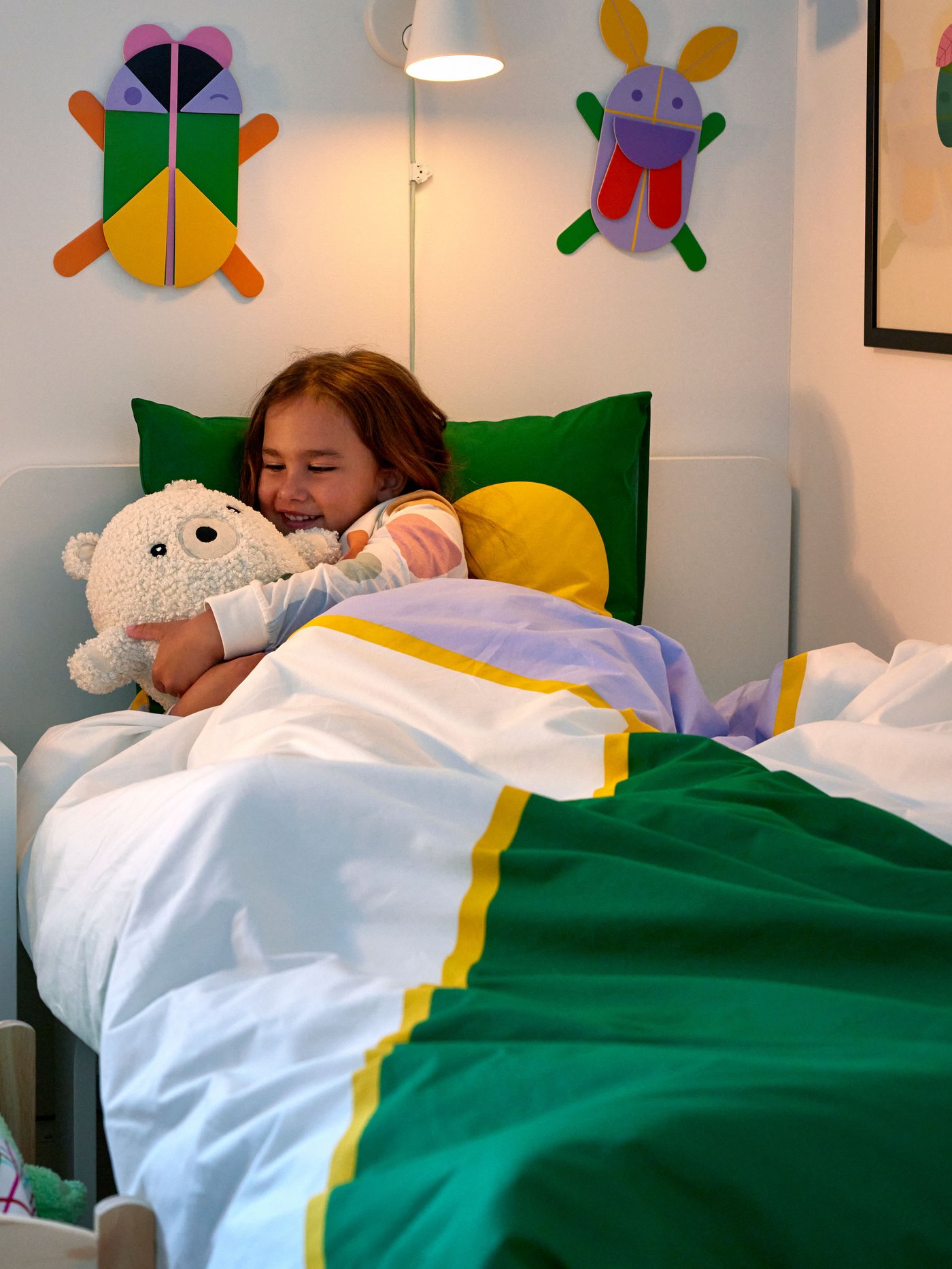 A bear/off-white GREJSIMOJS soft toy