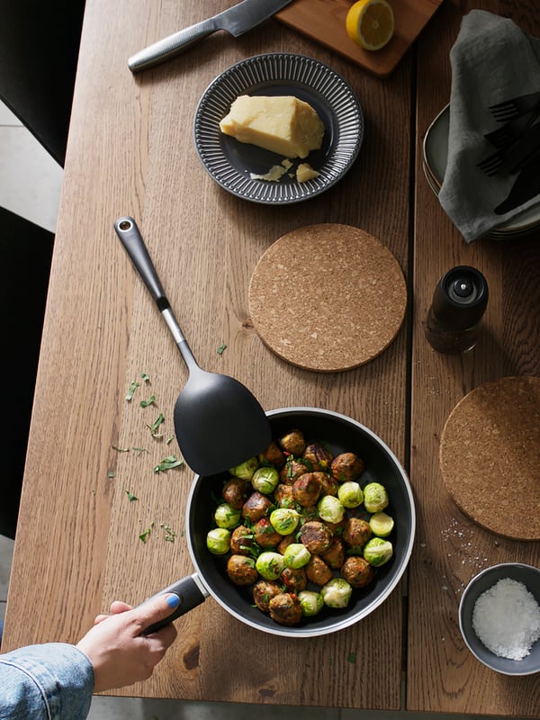 A black KAVALKAD frying pan