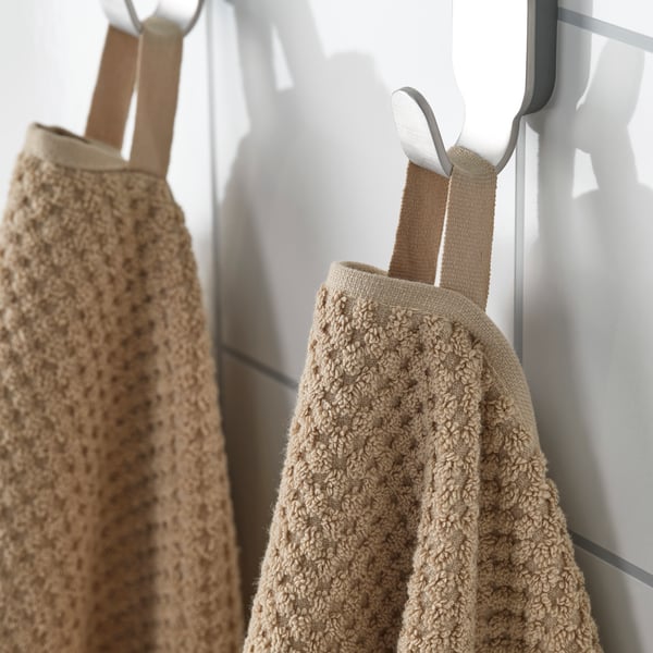 A beige GULVIAL hand towel in the NA