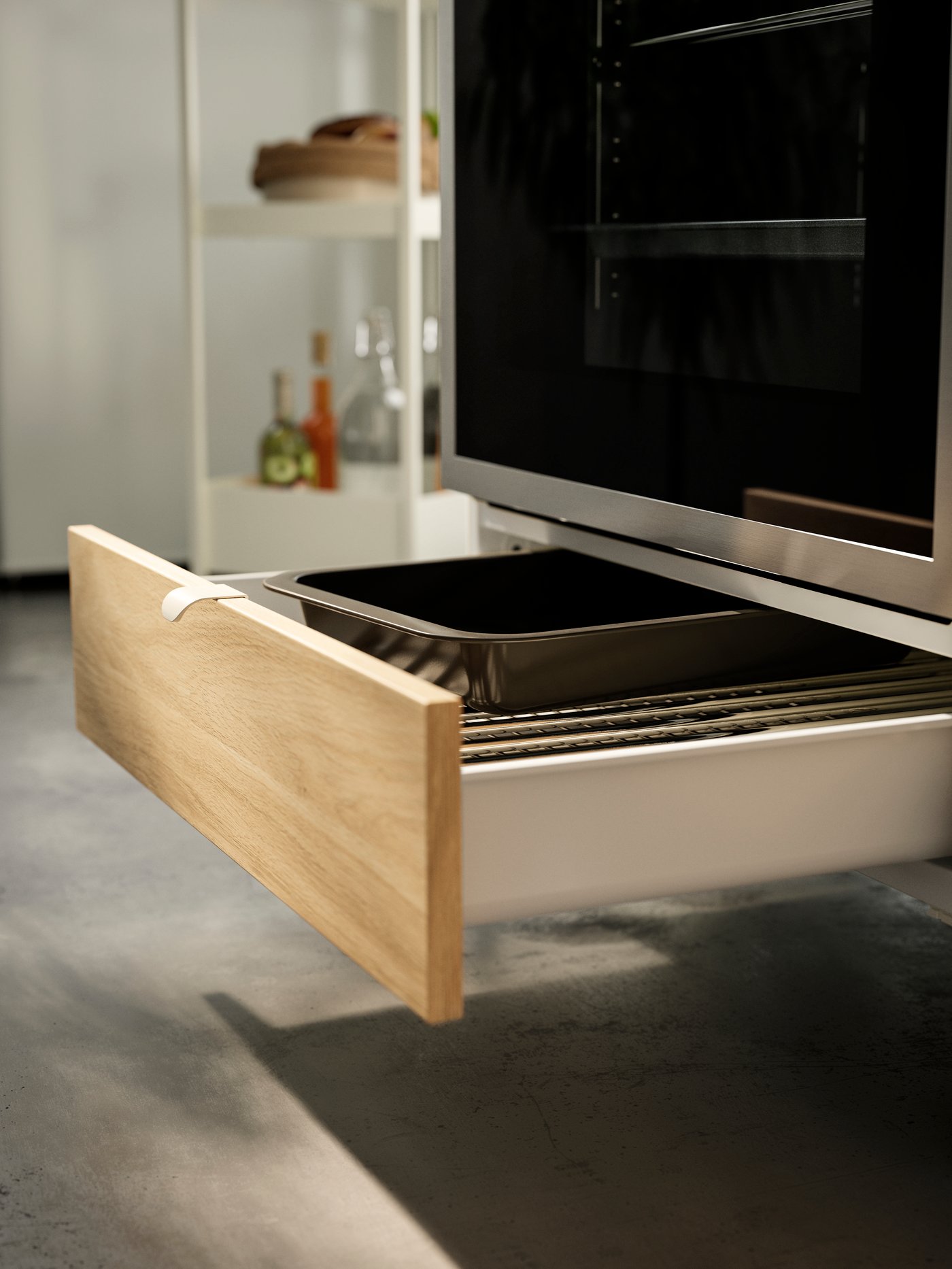 Utdragen låda under ugn.