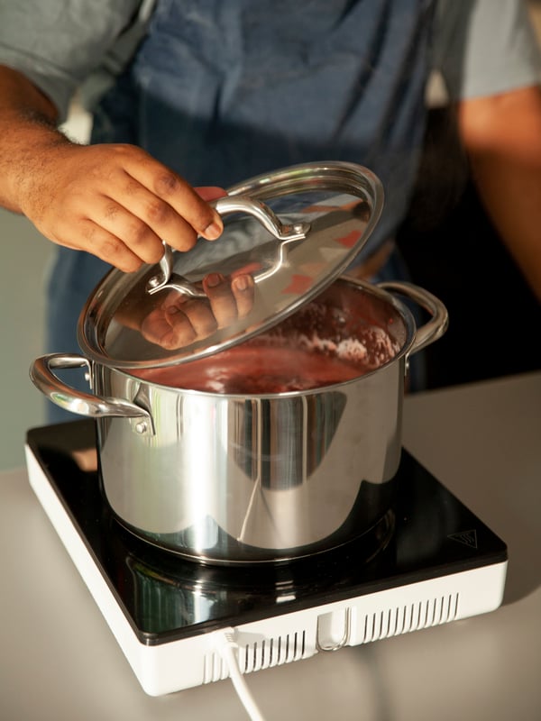A stainless steel IKEA 365+ pot with lid