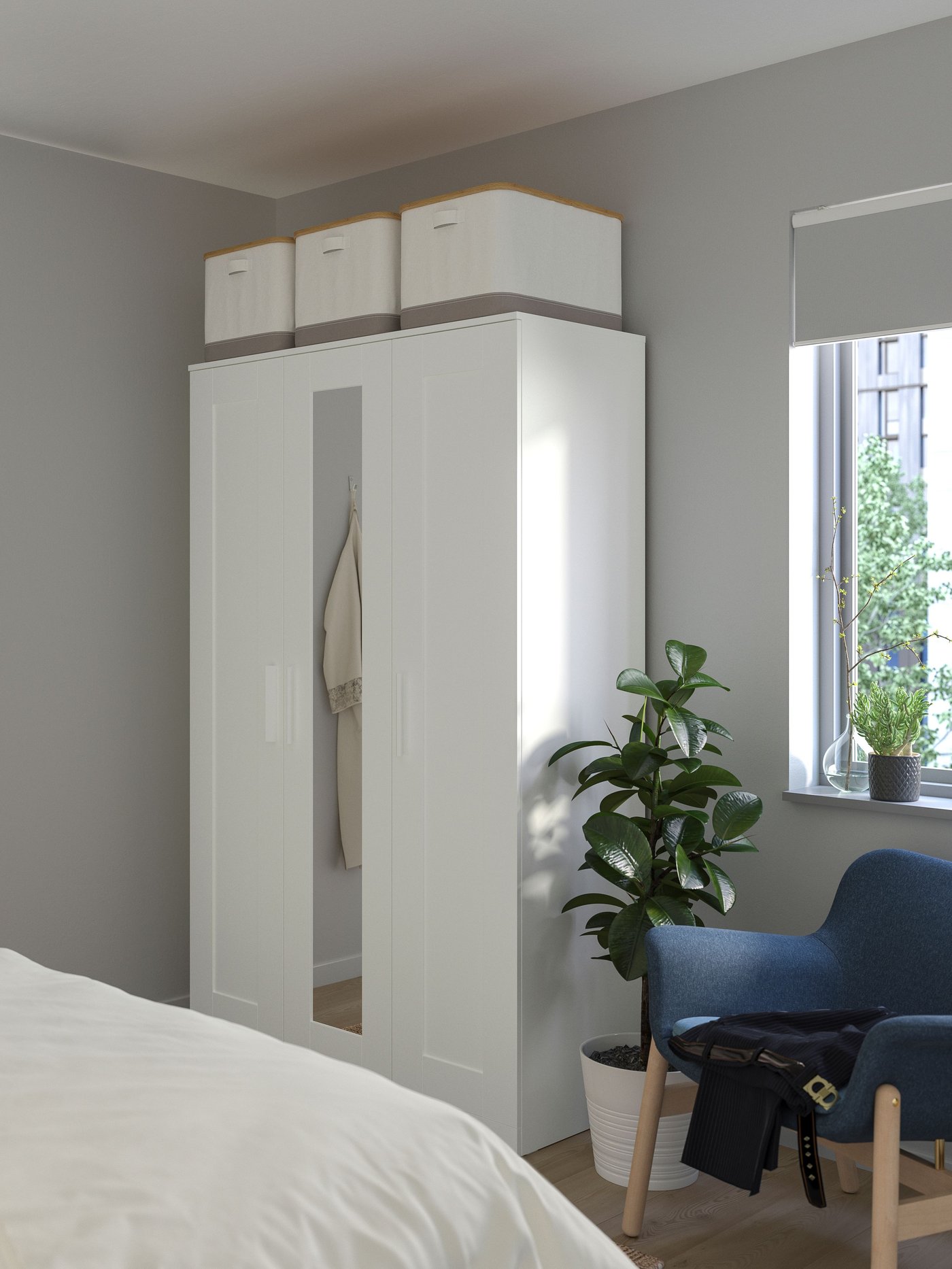 A white BRIMNES wardrobe with 3 doors