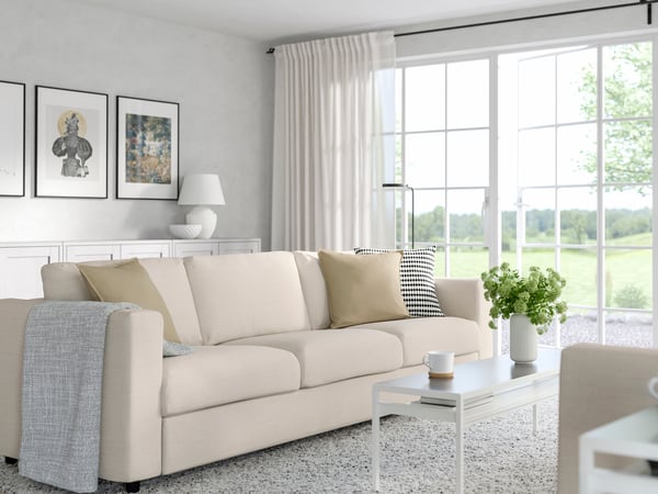 A spacious living room decorated with IKEA furniture.