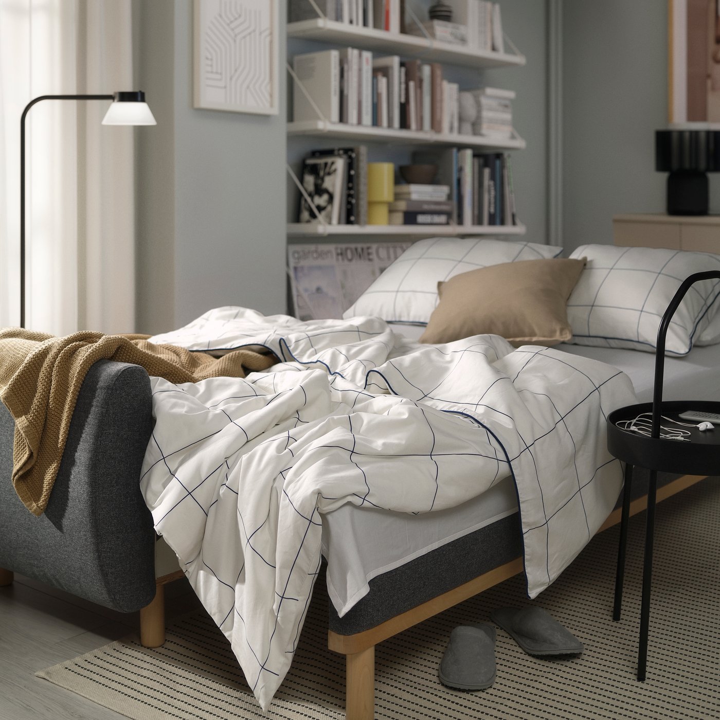 A Gunnared medium grey GRUNNARP 3-seat sofa-bed