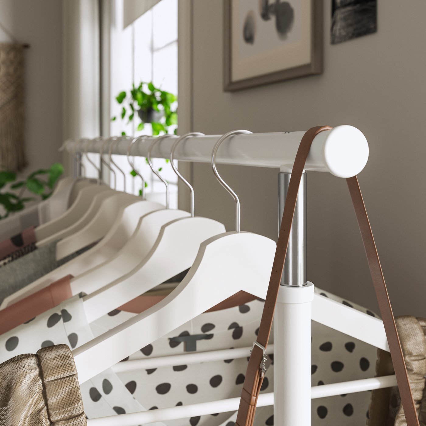 A white RIGGA clothes rack in the hallway