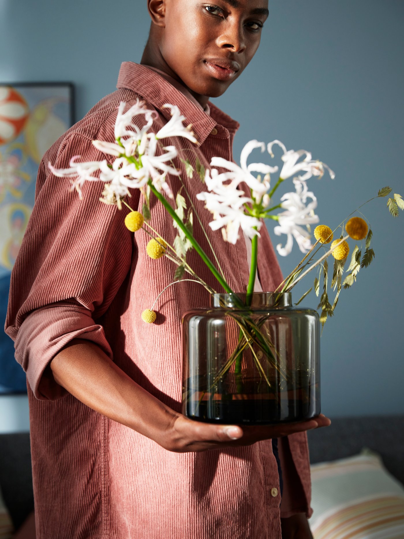 A green-brown KONSTFULL vase in the living room