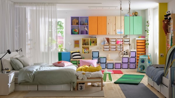 A pine IVAR shelving unit in the bedroom