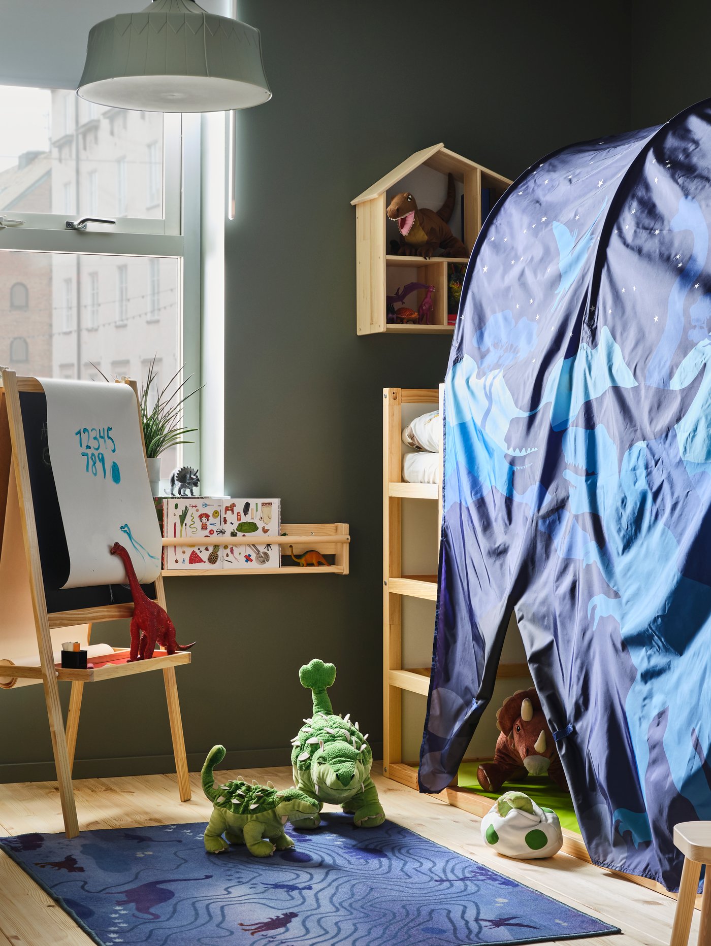 A light white stained pine FLISAT wall storage in the childrens room