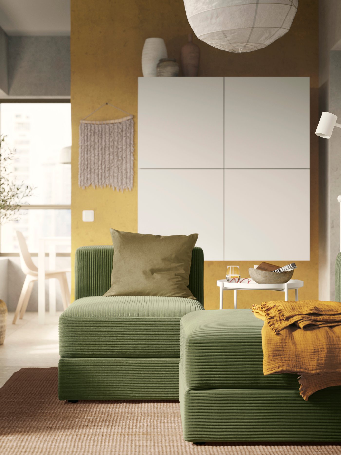 A Samsala dark yellow-green JÄTTEBO 1-seat module with storage